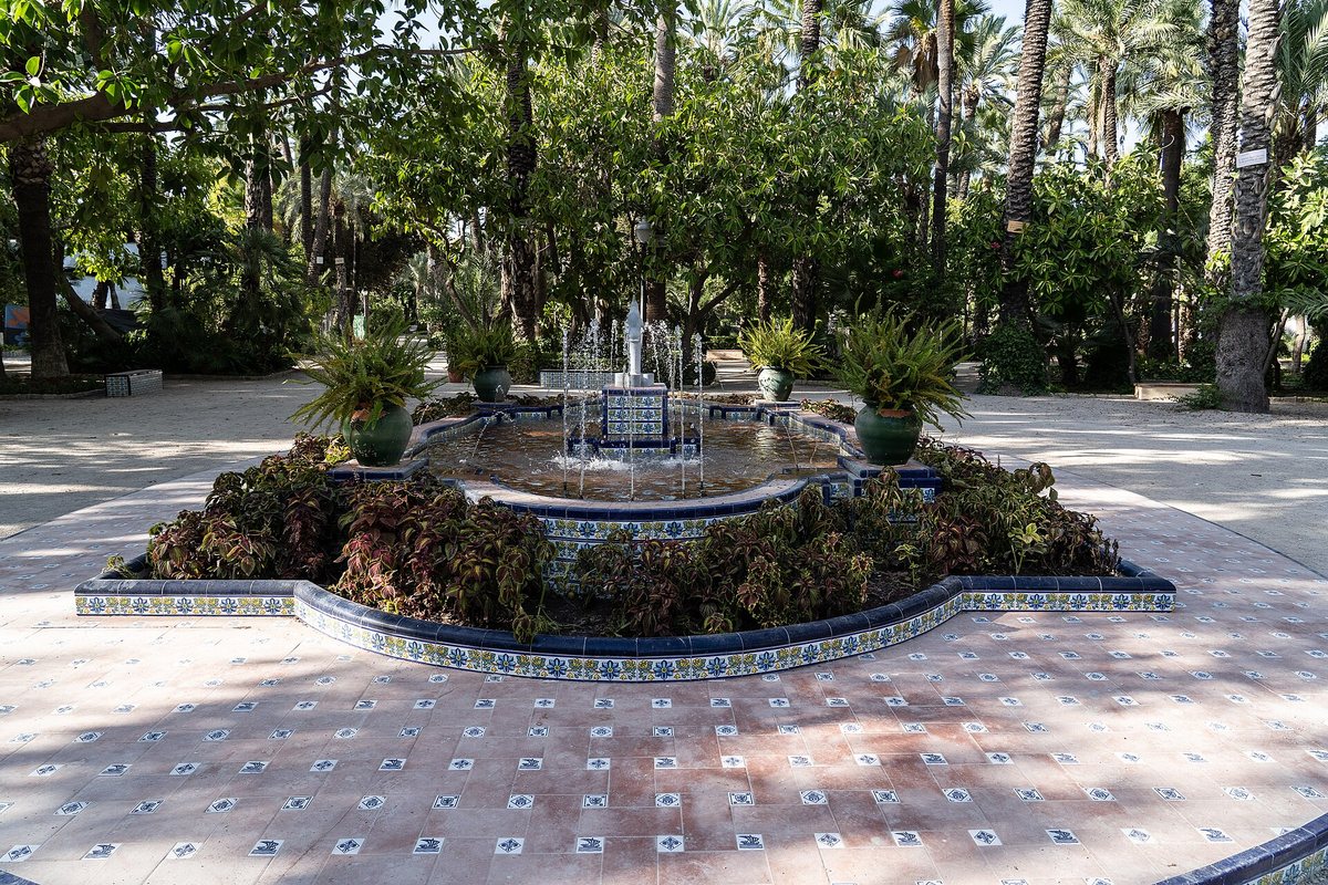 A fountain among the palms of the Palmeral of Elche