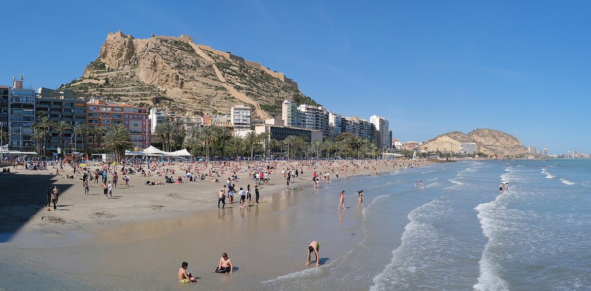 Postiguet city beach in Alicante, with the castle on the hill above