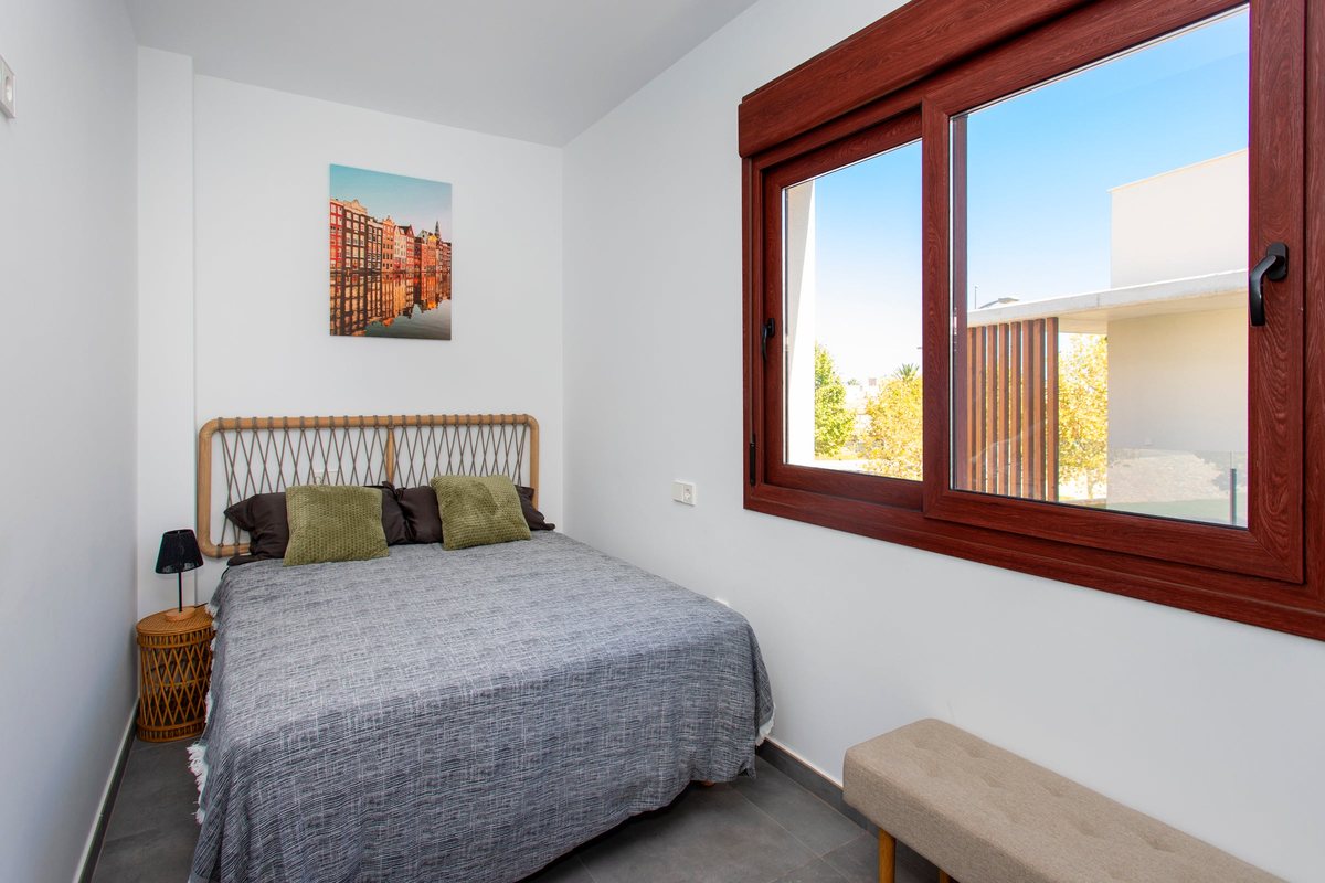Third bedroom with a double bed and a large window
