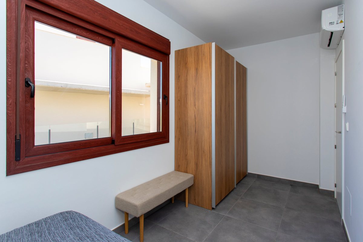 Third bedroom with wardrobe, bench and air conditioning